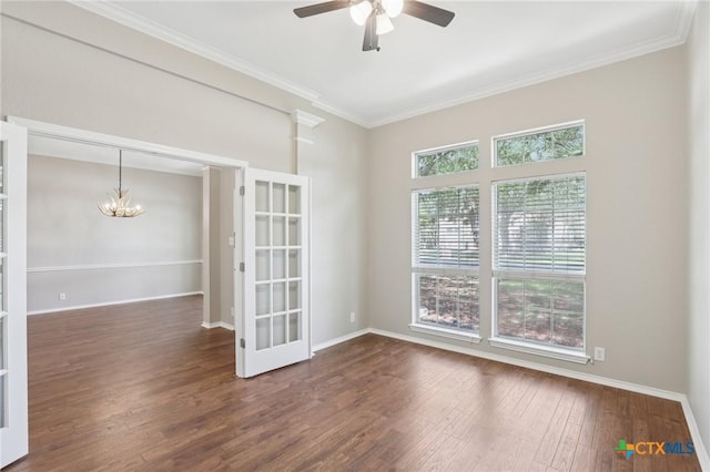251 Las Brisas Blvd, Seguin, TX 78155 - unfurnished room featuring dark wood-style flooring, a ceiling fan, ornamental molding, a chandelier, and baseboards