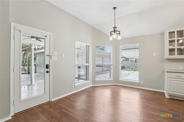 251 Las Brisas Blvd, Seguin, TX 78155 - unfurnished dining area with dark wood-type flooring, a chandelier, plenty of natural light, and lofted ceiling