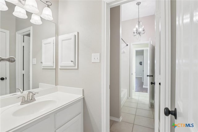 251 Las Brisas Blvd, Seguin, TX 78155 - bathroom featuring a chandelier, tile patterned floors, vanity, baseboards, and shower / washtub combination