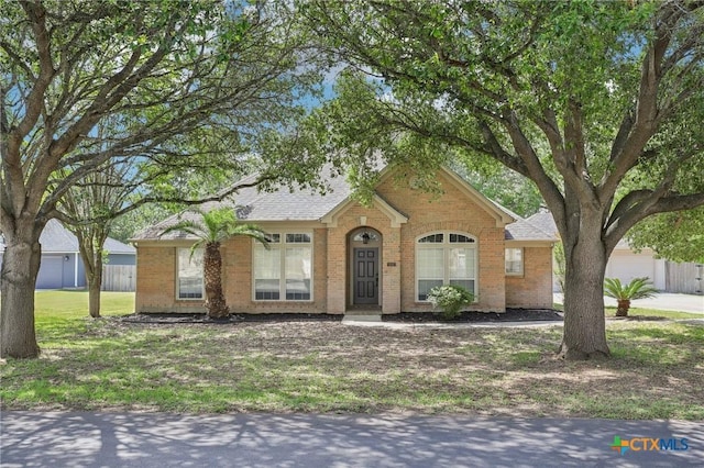 251 Las Brisas Blvd, Seguin, TX 78155 - view of front of property with brick siding and a shingled roof