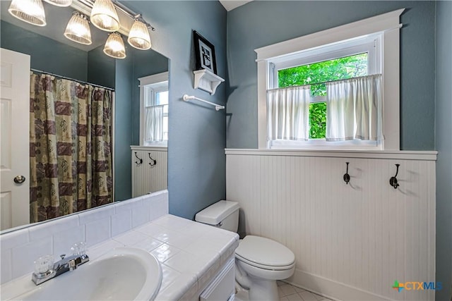 2006 Rose Cir, Harker Heights, TX 76548 - bathroom featuring wainscoting, vanity, tile patterned floors, and a shower with curtain