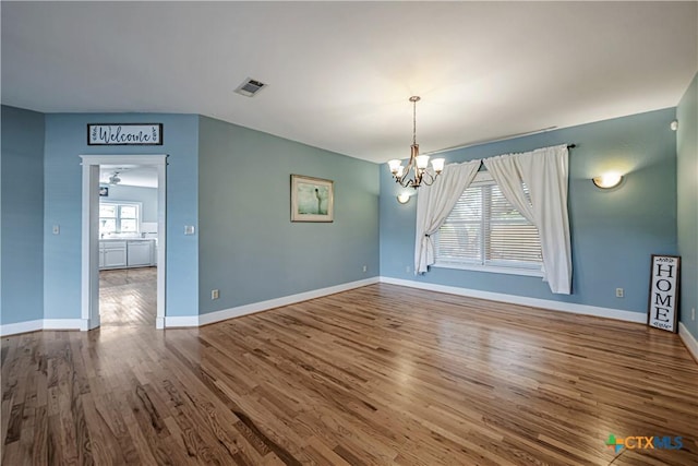 2006 Rose Cir, Harker Heights, TX 76548 - spare room featuring wood finished floors and a chandelier
