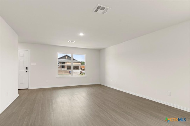 1007 Antelope Trl, Temple, TX 76504 - unfurnished living room with wood finished floors and recessed lighting