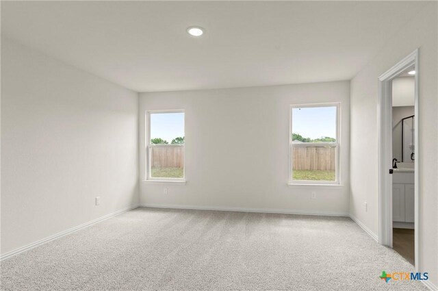 1007 Antelope Trl, Temple, TX 76504 - carpeted empty room featuring baseboards and recessed lighting