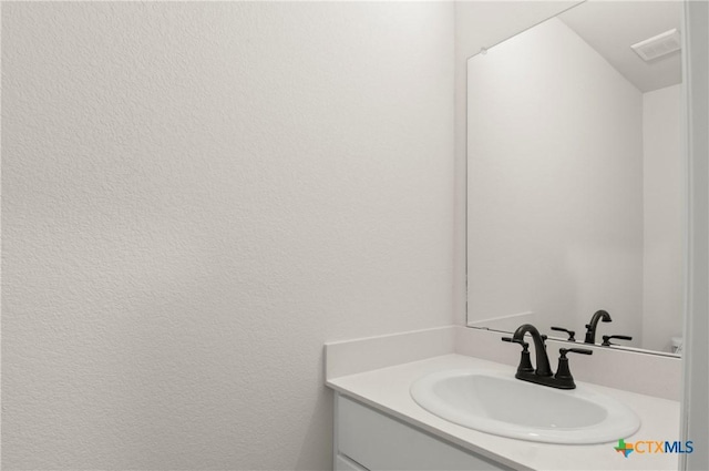 1007 Antelope Trl, Temple, TX 76504 - bathroom with vanity and a textured wall