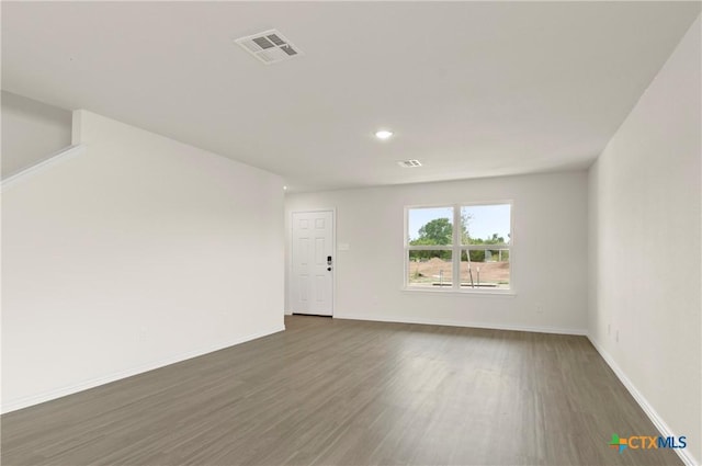 1007 Antelope Trl, Temple, TX 76504 - unfurnished room featuring dark wood-style flooring and recessed lighting