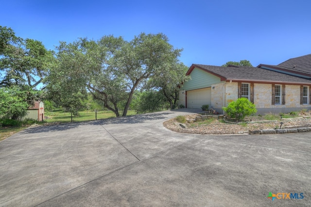 view of side of property with a garage