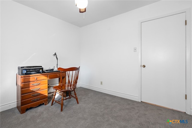 carpeted office space with ceiling fan