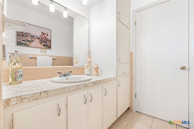 bathroom featuring vanity, tasteful backsplash, and tile patterned floors