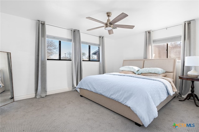 bedroom with light carpet and ceiling fan