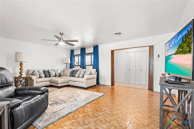 living room with ceiling fan and light parquet floors