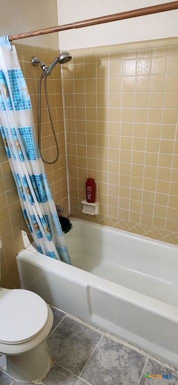 bathroom with tile patterned flooring, toilet, and shower / tub combo