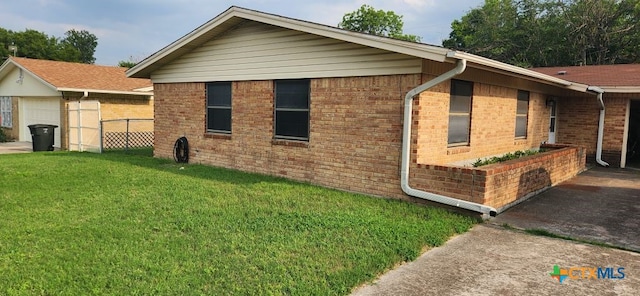 view of home's exterior with a lawn