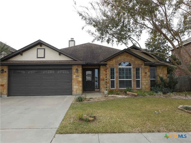 single story home featuring a front yard and a garage