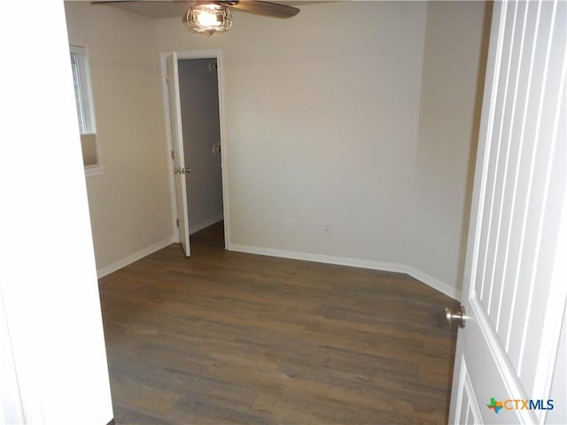 empty room with dark wood-type flooring