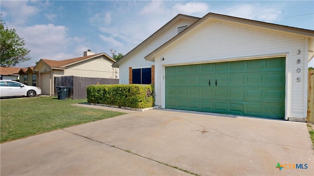 view of front of house featuring driveway, a front yard, and fence
