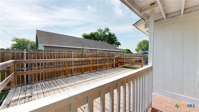 wooden deck featuring a fenced backyard