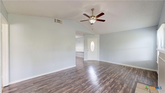 unfurnished living room featuring wood finished floors, ceiling fan, baseboards, lofted ceiling, and visible vents