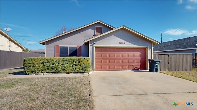 ranch-style house featuring concrete driveway, an attached garage, fence, and a front yard