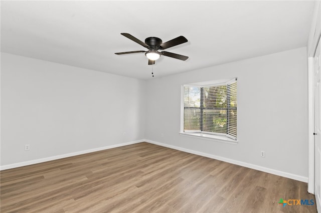 unfurnished room with light hardwood / wood-style floors and ceiling fan