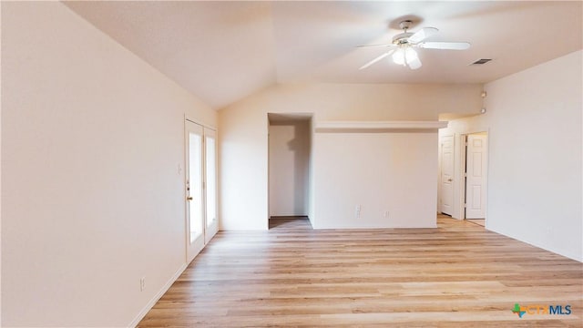 spare room with light wood-type flooring, ceiling fan, visible vents, and lofted ceiling