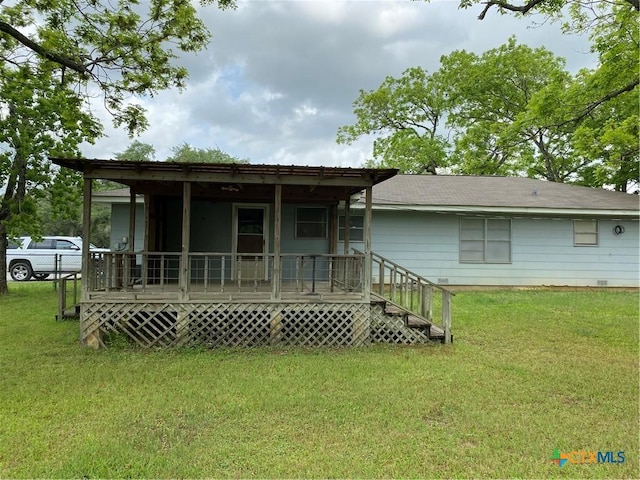 589 Bluebonnet Ln, Yoakum, TX 77995 - back of house with a yard and a porch