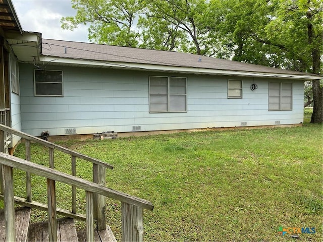589 Bluebonnet Ln, Yoakum, TX 77995 - view of property exterior featuring roof with shingles, a yard, and crawl space