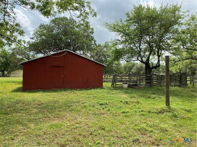 589 Bluebonnet Ln, Yoakum, TX 77995 - view of pole building featuring fence and a lawn