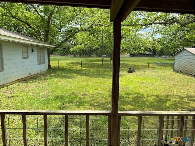 589 Bluebonnet Ln, Yoakum, TX 77995 - view of yard with a fenced backyard, an outbuilding, and a storage shed