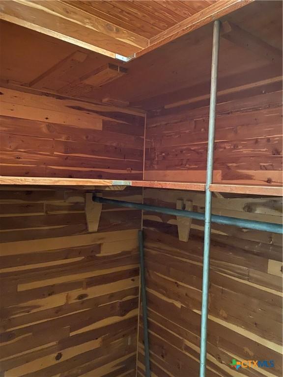 589 Bluebonnet Ln, Yoakum, TX 77995 - room details featuring wooden ceiling and wood walls