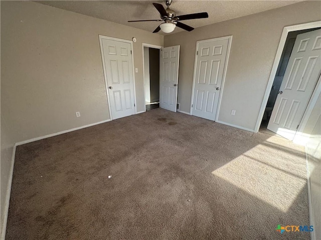 unfurnished bedroom with ceiling fan, a textured ceiling, and carpet flooring