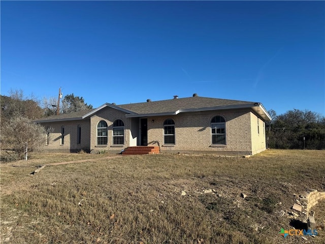 view of front of home with a front yard