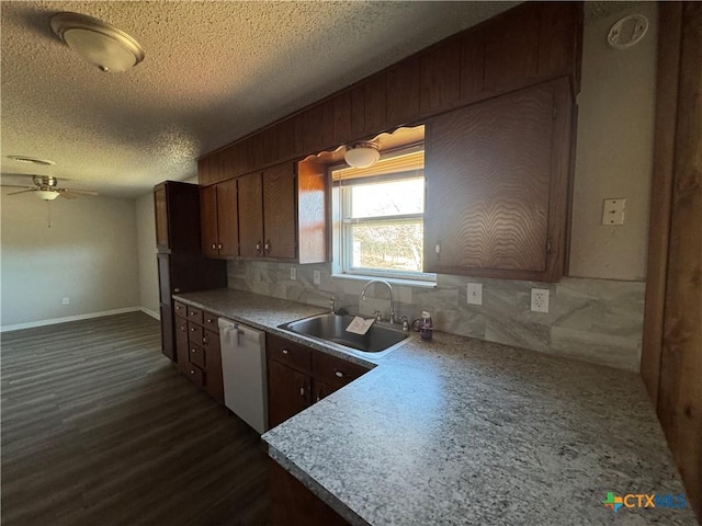 kitchen with dishwasher, ceiling fan, sink, backsplash, and a textured ceiling