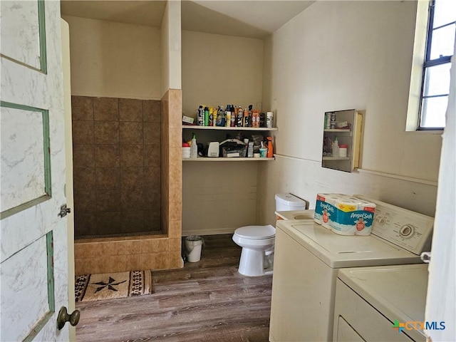 7318 Cryer Ln, Temple, TX 76502 - bathroom featuring washer and clothes dryer, toilet, and wood finished floors