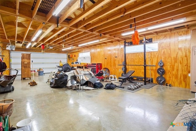 garage featuring wood walls