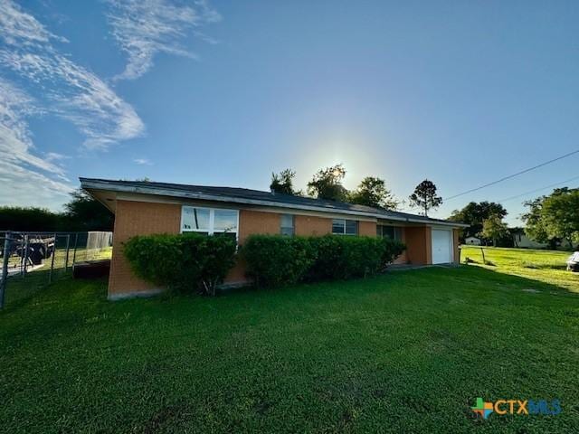 2009 S Laurent St, Victoria, TX 77901 - rear view of house with an attached garage