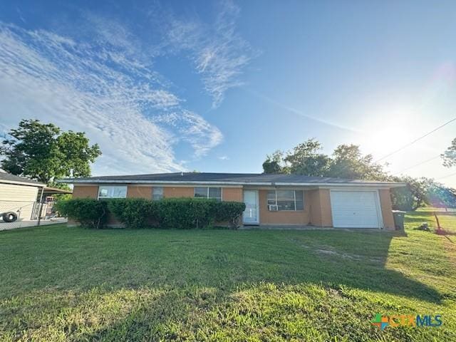 2009 S Laurent St, Victoria, TX 77901 - single story home featuring a front lawn and an attached garage