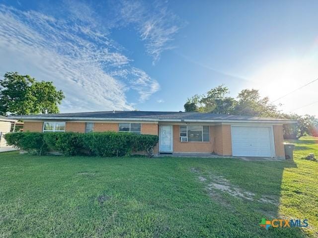 2009 S Laurent St, Victoria, TX 77901 - ranch-style home featuring an attached garage, a front yard, and driveway