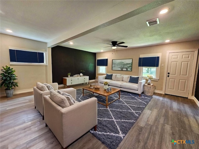 958 E Humphreys St, Seguin, TX 78155 - living area with wood finished floors, a ceiling fan, recessed lighting, and a textured ceiling