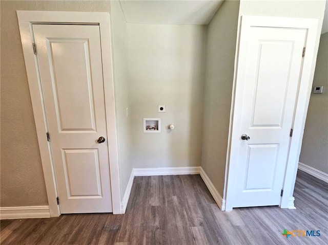 958 E Humphreys St, Seguin, TX 78155 - laundry area with electric dryer hookup, dark wood-type flooring, and baseboards
