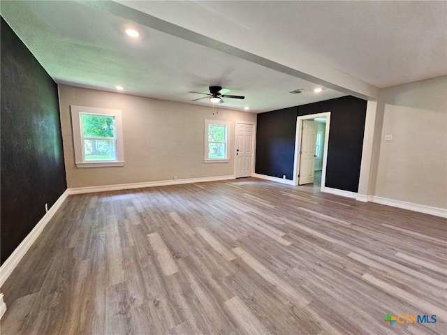 958 E Humphreys St, Seguin, TX 78155 - spare room featuring wood finished floors, baseboards, plenty of natural light, and recessed lighting