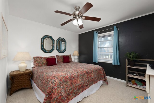 bedroom featuring ceiling fan and light carpet