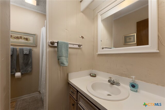 bathroom featuring vanity and a textured ceiling