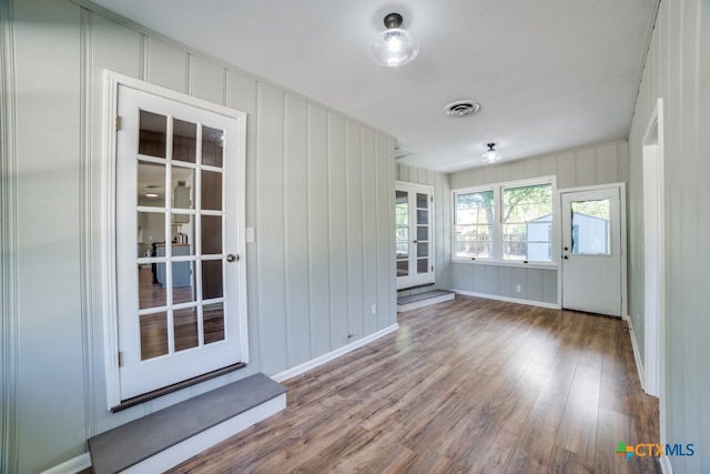 spare room with hardwood / wood-style floors