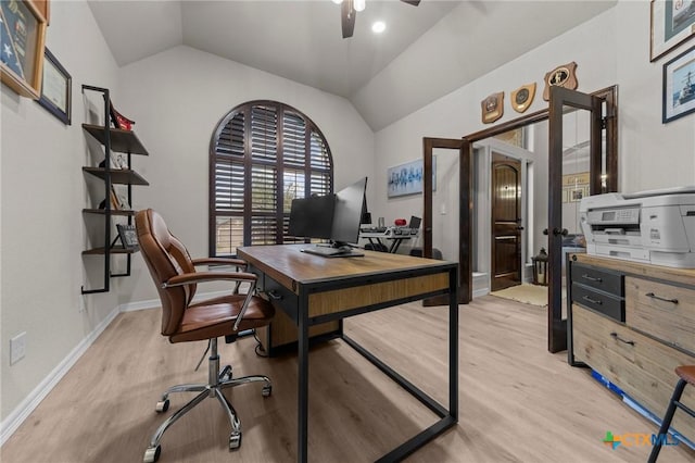 office featuring lofted ceiling, ceiling fan, and light wood-type flooring