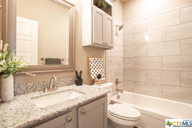 1018 Winchester Dr, Nolanville, TX 76559 - bathroom featuring toilet, vanity, and shower / tub combination