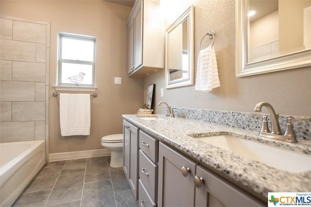 1018 Winchester Dr, Nolanville, TX 76559 - full bathroom featuring toilet, baseboards, and double vanity
