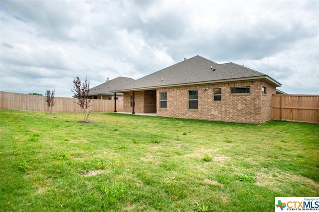 1018 Winchester Dr, Nolanville, TX 76559 - back of property with brick siding and roof with shingles