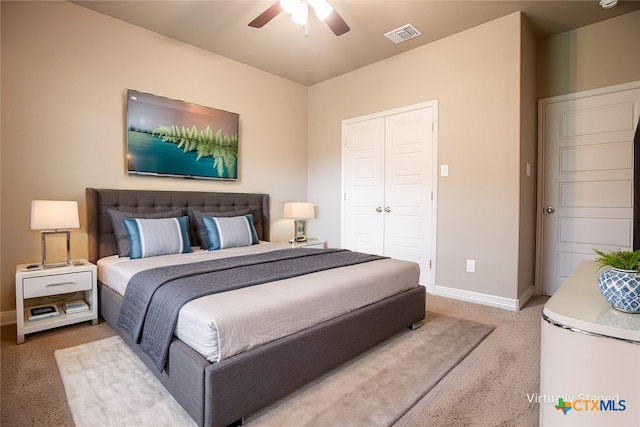 bedroom featuring a closet, carpet flooring, and ceiling fan