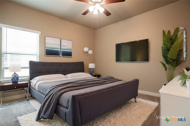 carpeted bedroom with ceiling fan